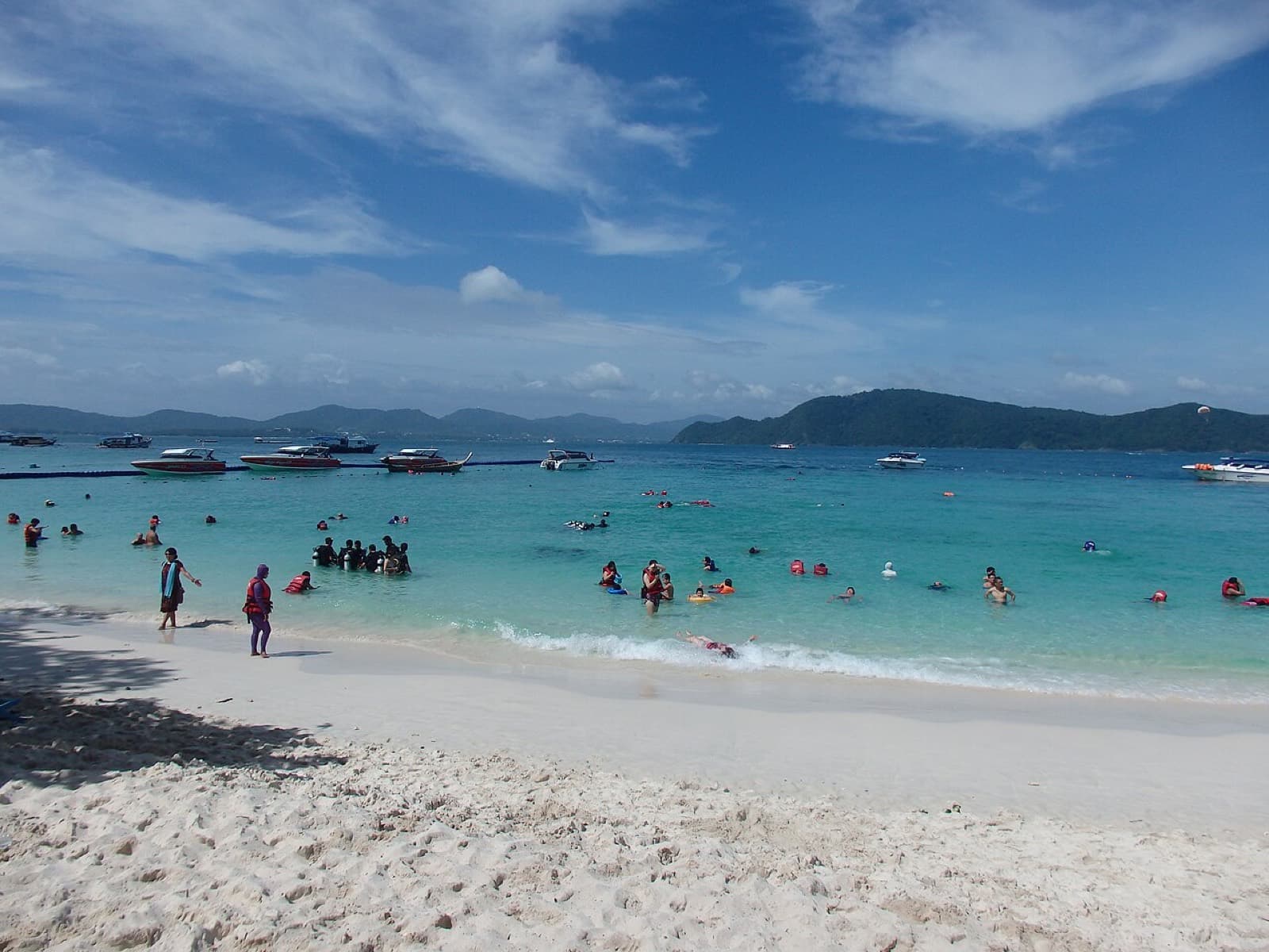 Swimmers on the beach at Coral Island